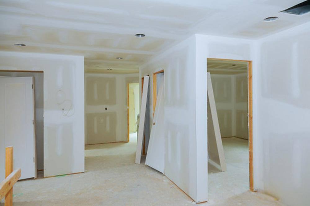 Drywall & Framing — Hanging, taping, and finishing across multiple units, sequenced so trades stay o