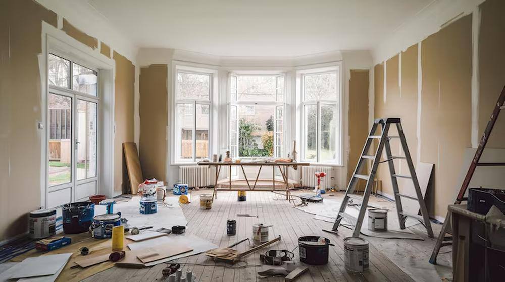 Full Restoration — Water-damaged plaster and stripped floors brought back to finished trim, refinis